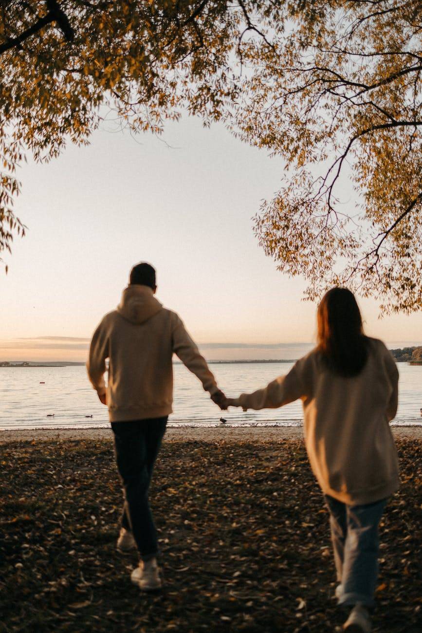 a couple walking on the beach